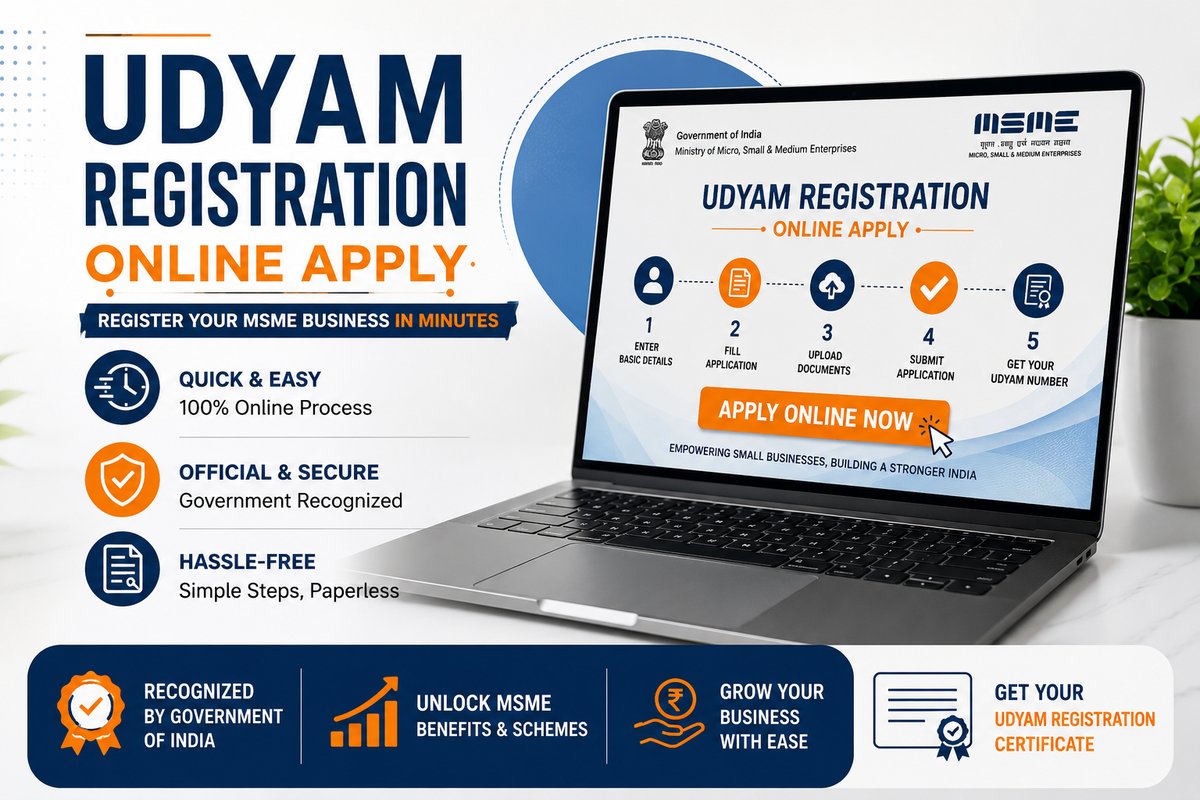 Indian man at laptop on wooden desk — filling Udyam online registration form
